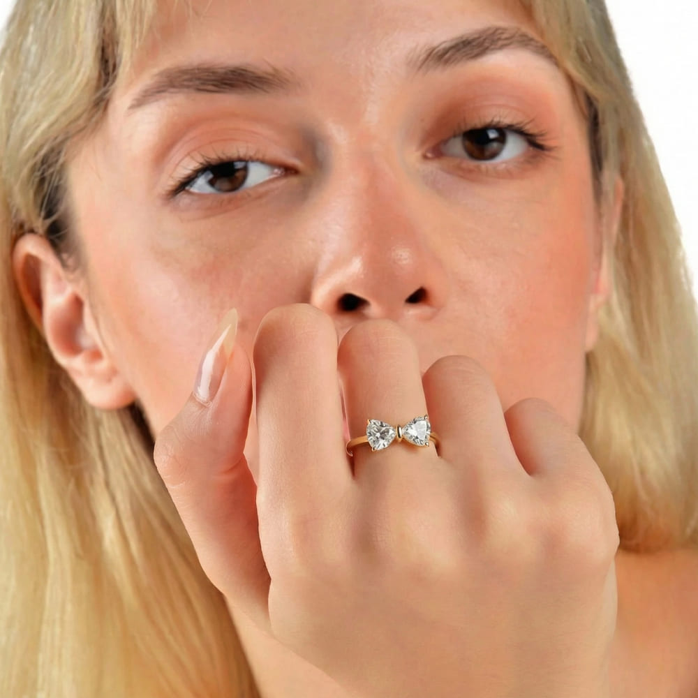 Gold Bow Ring with Radiant Stone Center