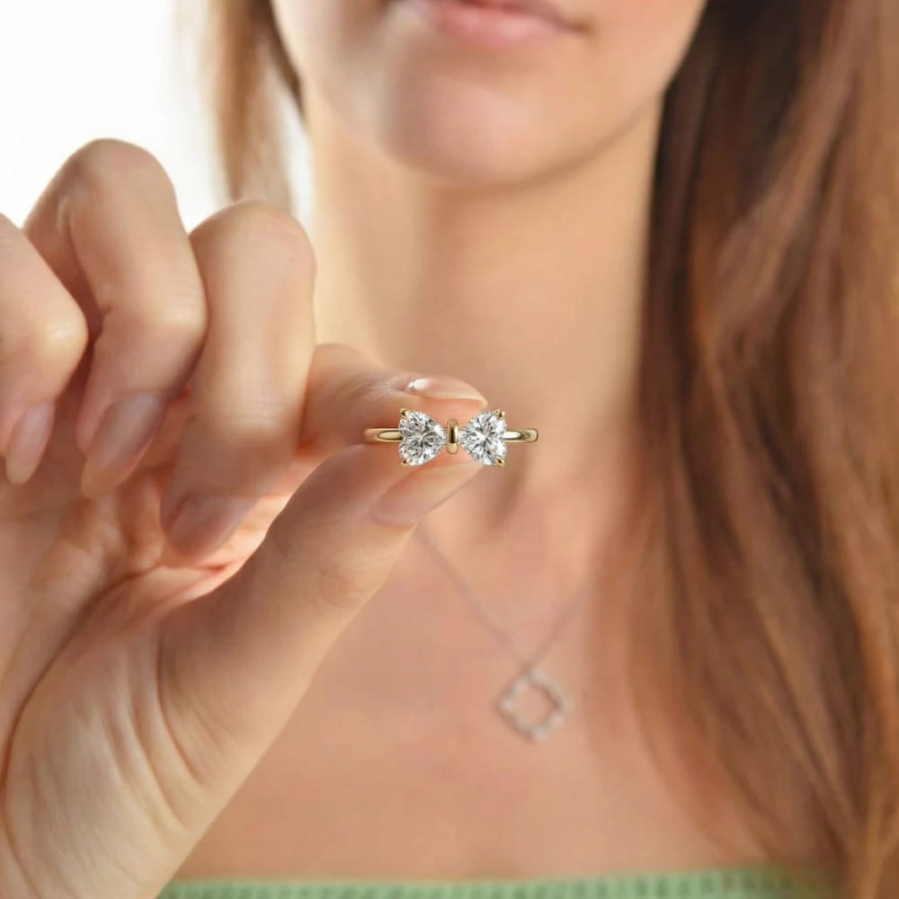 Gold Bow Ring with Radiant Stone Center