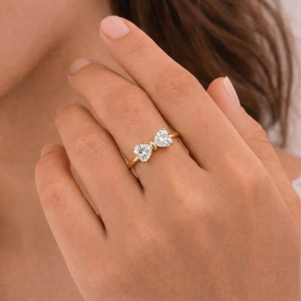 Gold Bow Ring with Radiant Stone Center