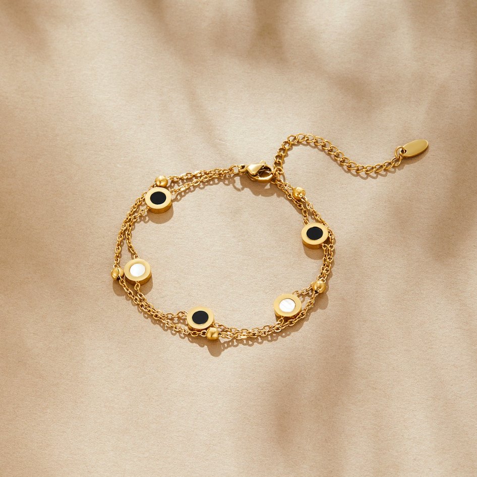 Gold Bracelet with Onyx and White Stone