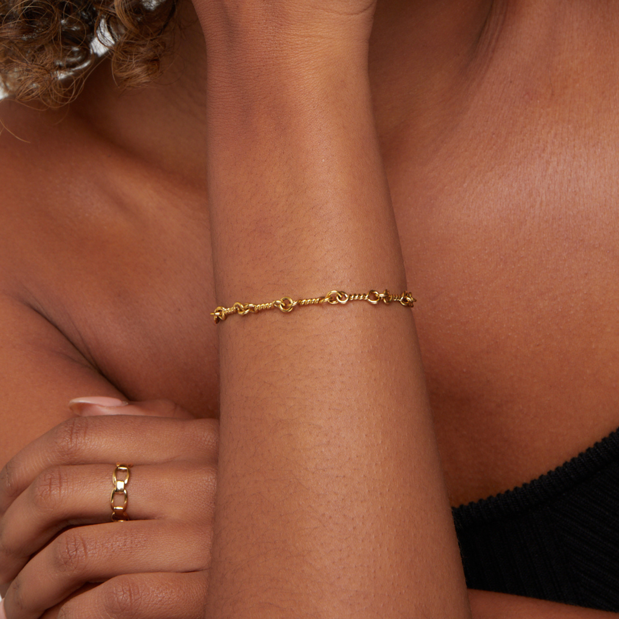 Gold Tone Figaro Knot Chain Bracelet