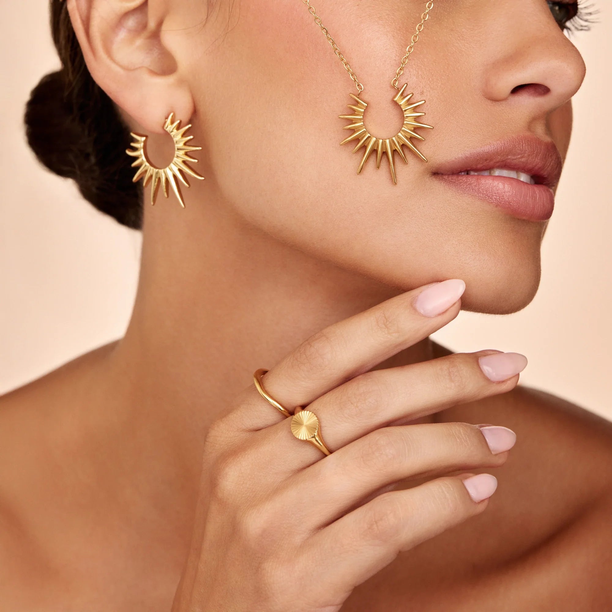 Gold Sunburst Hoop Earrings with Radiating Spike Design