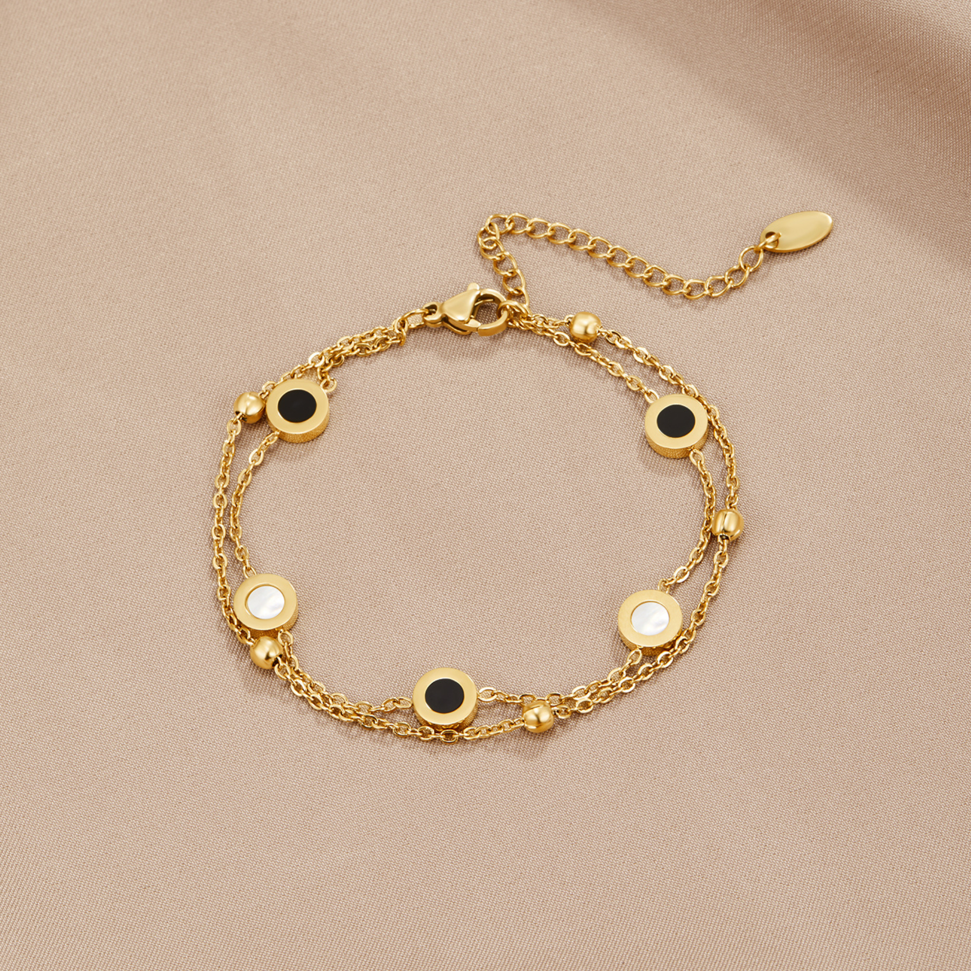 Gold Bracelet with Onyx and White Stone