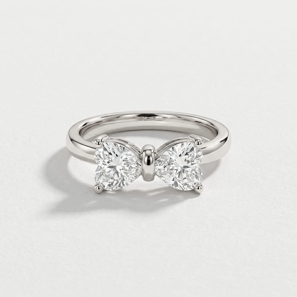 Gold Bow Ring with Radiant Stone Center