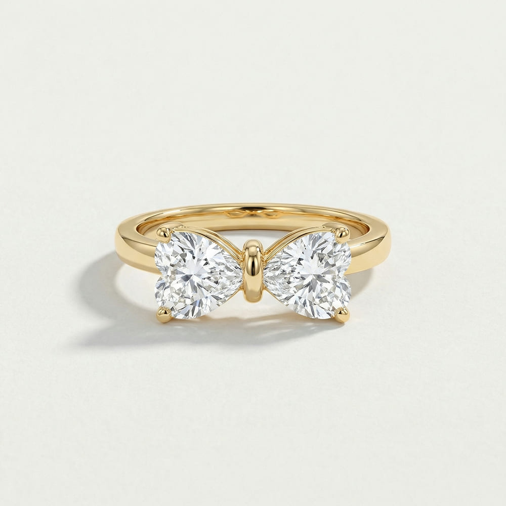 Gold Bow Ring with Radiant Stone Center