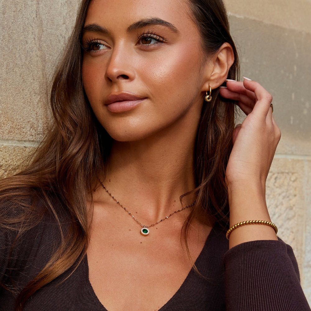Gold Tone Necklace with Green Crystal Pendant