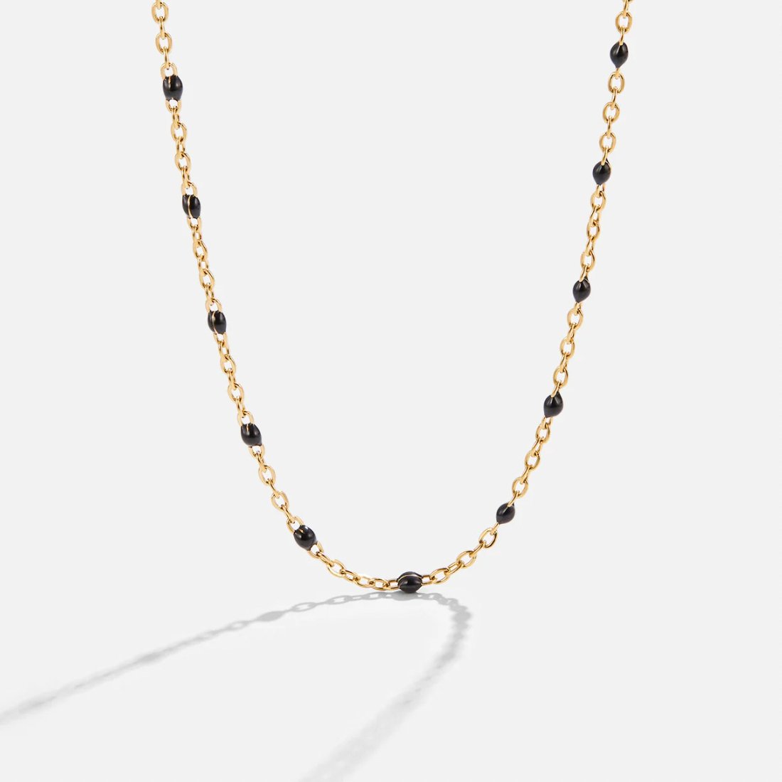 Gold Tone Necklace with Black Beads