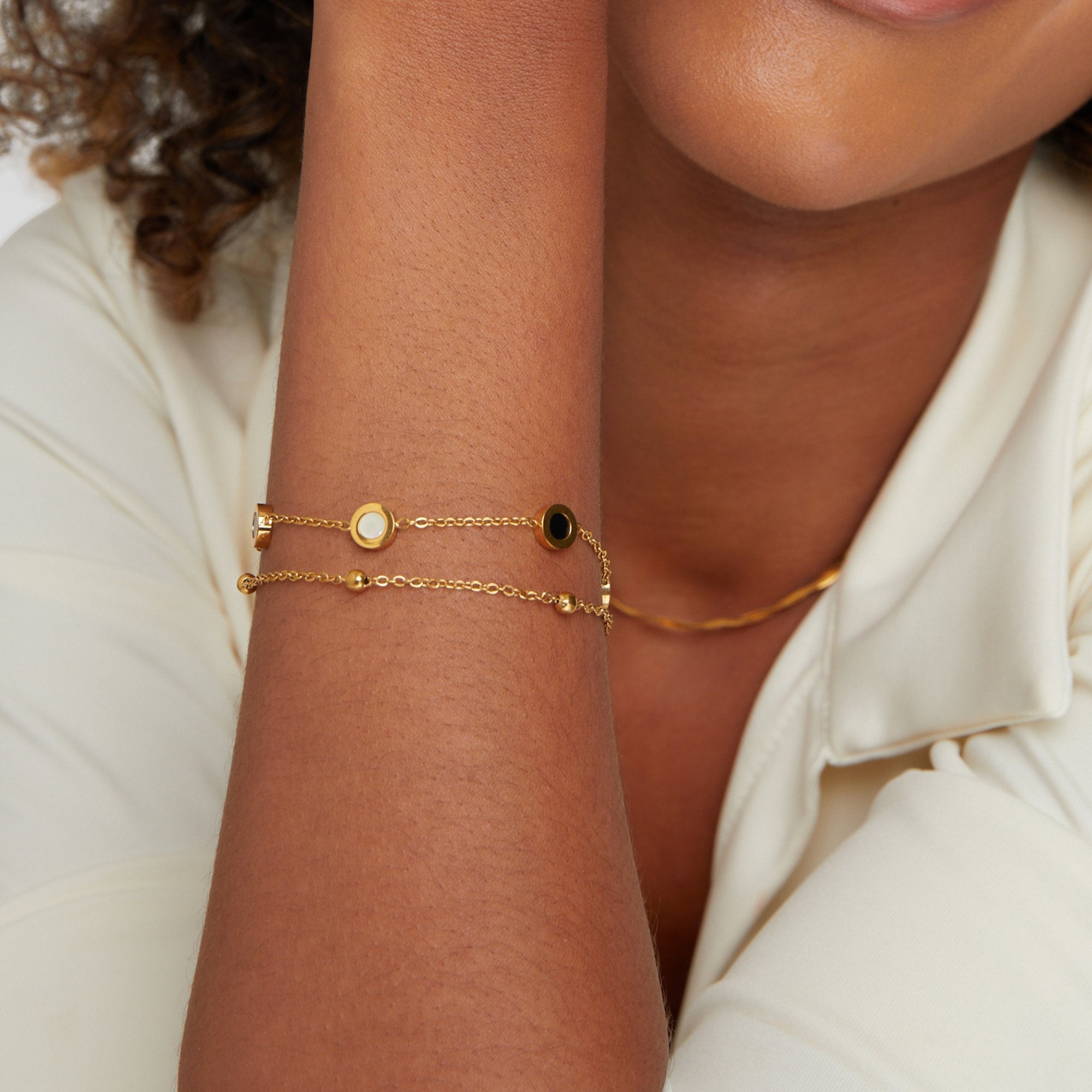 Gold Bracelet with Onyx and White Stone